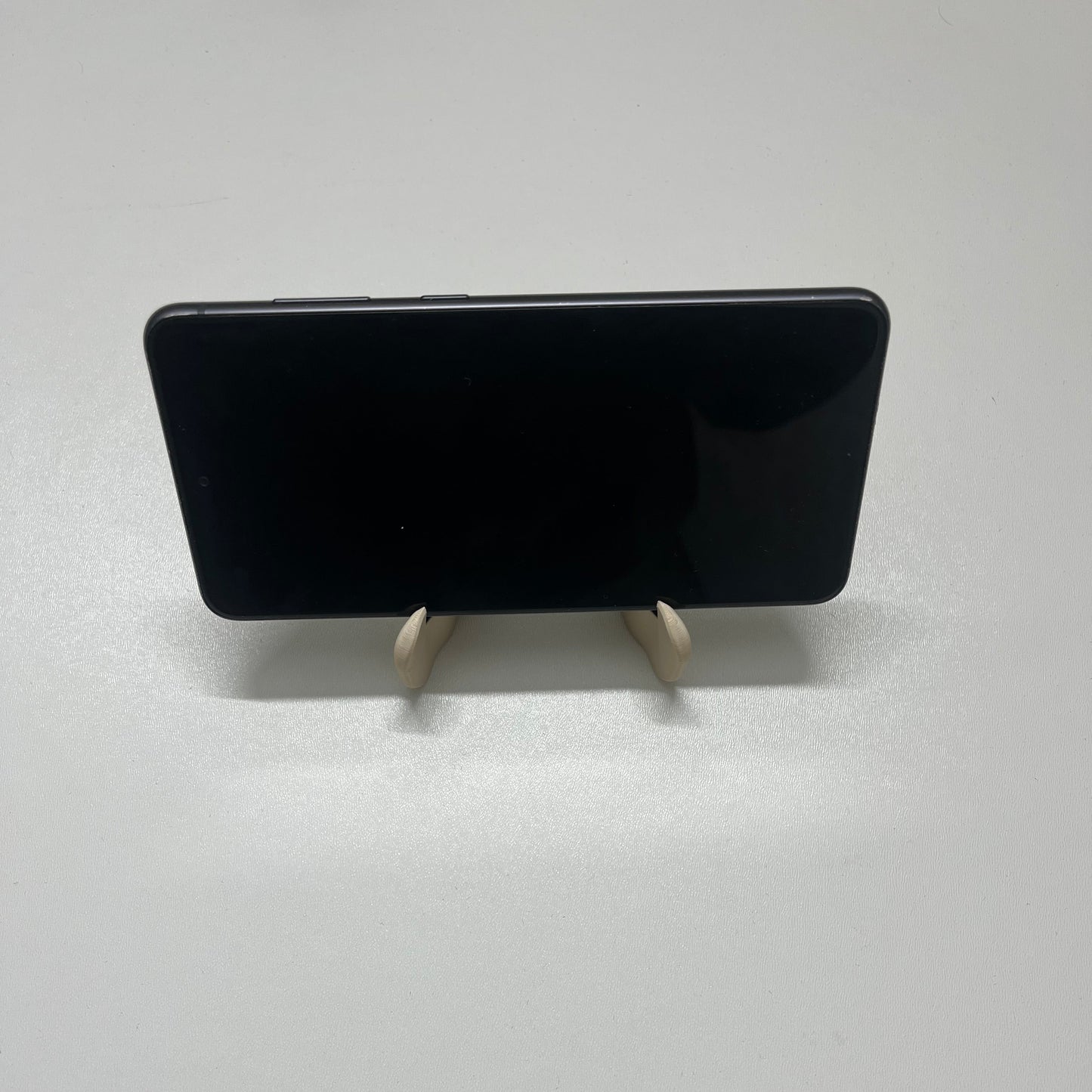 Holdy – Fidget toy aimanté et support de téléphone 2-en-1